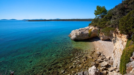 Scenic view of a rocky beach and clear blue sea