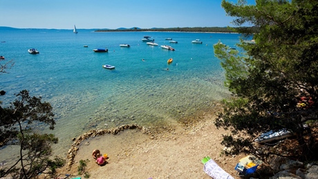 Scenic beach with boats on the Adriatic Sea