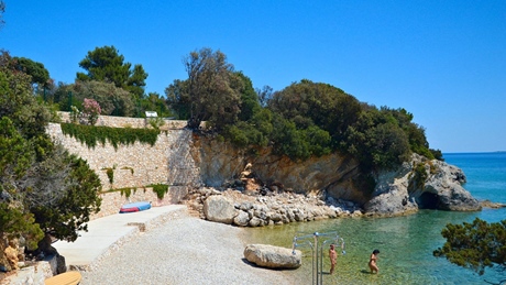Scenic beach with clear water and rocky shoreline