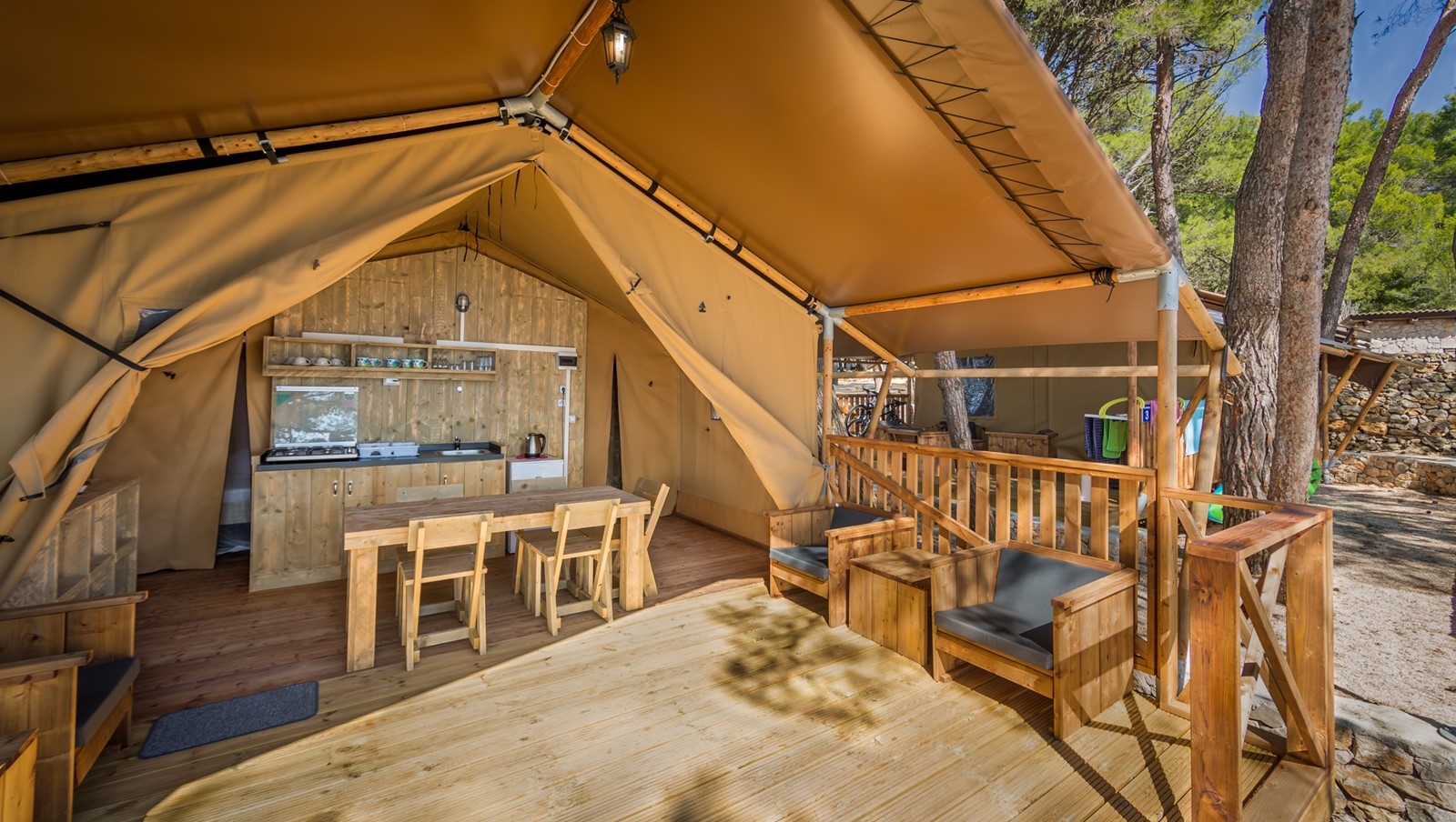 Baldarin glamping tent with wooden interior and ocean view