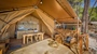 Baldarin glamping tent with wooden interior and ocean view