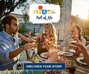 Group of friends enjoying a meal in Croatia, full of life